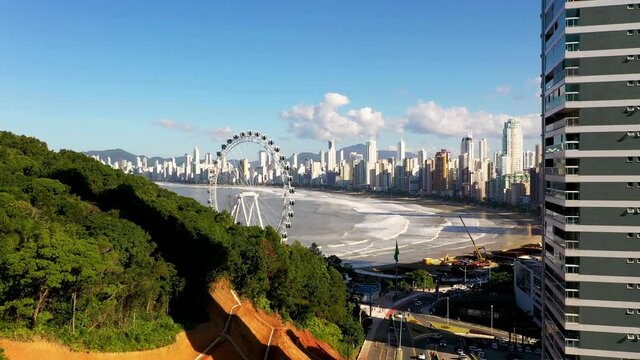 Aerial view of ferris wheel, touristic attraction at Balne&aacute;rio Cambori&uacute;, Brazil.