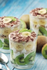 Trifle desserts with bananas, kiwi and yogurt