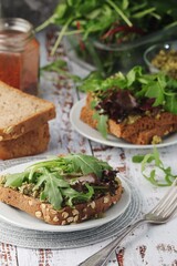 Homemade sandwiches with pesto and green salad