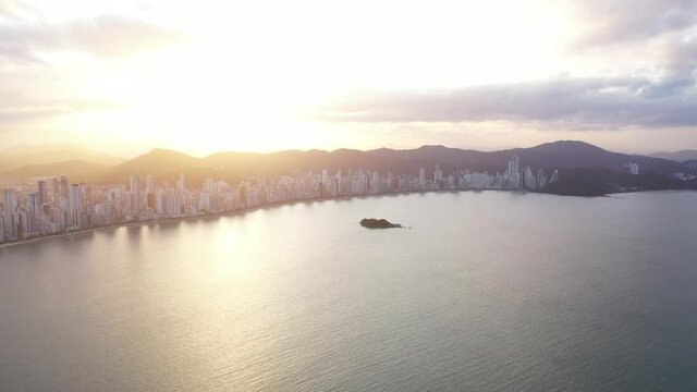 Aerial view of Balne&aacute;rio Cambori&uacute; cityescape during sunset, Brazil.