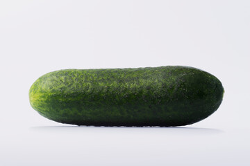 Cucumbers in a basket on a white isolated background. Fresh cucumber on a white background. 