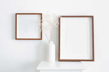 Stylish and modern frames mockup for artwork, print or photo presentation. Blank wooden frames on...