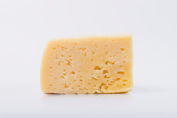 Cheese on a white isolated white background. Cheese texture.