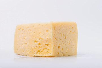 Cheese on a white isolated white background. Cheese texture.