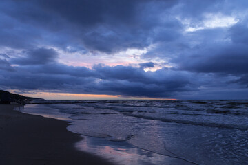 cloudy sunset over the sea, menacing sky and rough waves