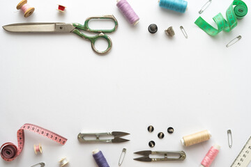 Flat lay composition with scissors and other sewing accessories on white background. Space for text - Powered by Adobe
