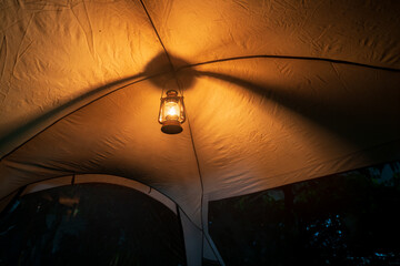 kerosene lamp inside the tent at night