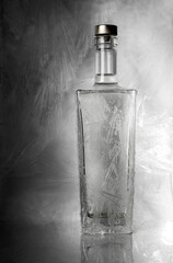 Glass bottle closed with a lid with a frost pattern