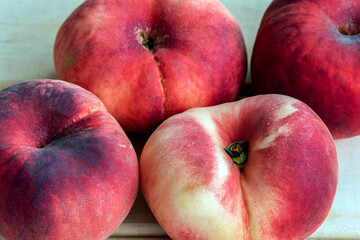 Peaches-donuts on a wooden desk