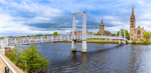 Fototapeta premium A panorama view of the Greg Street bridge over the River Ness in Inverness, Scotland on a summers day