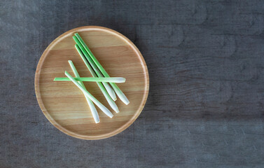 fresh lemongrass on a wooden tray