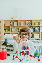 Elementary school student during a Chemistry lesson