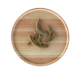 young tamarind in a wooden tray on a white background