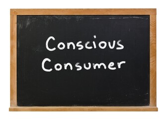 Conscious consumer written in white chalk on a black chalkboard isolated on white 