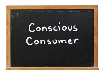 Obraz premium Conscious consumer written in white chalk on a black chalkboard isolated on white 