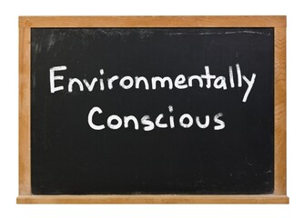 Environmentally conscious written in white chalk on a black chalkboard isolated on white