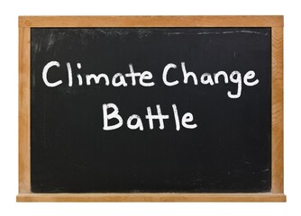Climate change battle written in white chalk on a black chalkboard isolated on white