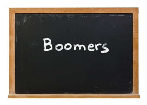 Boomers Written In White Chalk On A Black Chalkboard Isolated On White