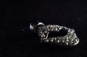 Closeup shot of a beautiful diamond brooch in the shape of a lip