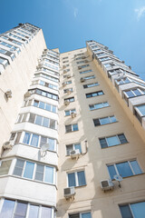 Fototapeta na wymiar Moscow, Russia - 03 August 2021: Moscow, view of a multi-storey building from below to the sky.