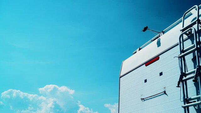 Caravan detail, rv back with rear view camera and ladder. Car parking camera.