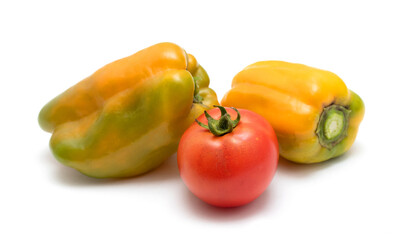 Red ripe tomato and bell pepper isolated on a white background.