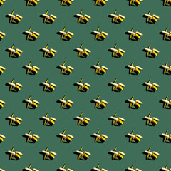 Seamless pattern of bananas on a uniform colored background.