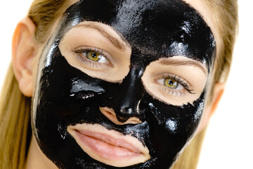 Girl black carbo peel off mask on face