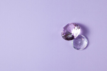 Purple precious gemstones for design gems jewellery. Diamonds crystal on turquoise background.