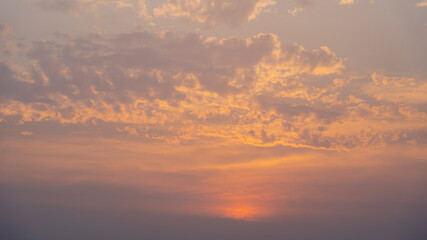Colorful golden orange sunset twilight evening sky.