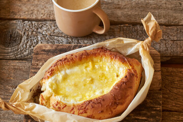 Adjaruli (Acharuli) Khachapuri, Georgian cheese bread. Traditional Georgian recipe made with a bread dough, filled with cheese and crowned with an egg and a butter. 