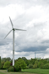 Karlsruhe, Maxau Germany: Wind turbine with thunderstorm sky and green landscape