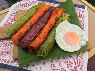 Colorful dough sheet vegetable wrapped rice noodles with fried egg