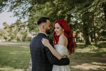 Wedding day. Happy bride and groom hugging and laughing Red hair diversity