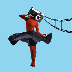 Surrealism. Young woman headed with retro-style camera in colored clothes stands over blue background