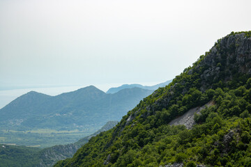 National Park lake Skadar and mountains Dinar highlands of the foggy morning. The largest lake on the Balkans, Montenegro. Popular tourist destination and beautiful nature landscape.