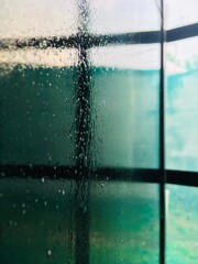 Close-up Of Wet Glass Window
