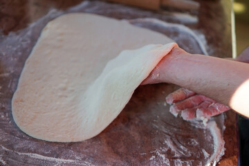 Fototapeta na wymiar person kneading dough