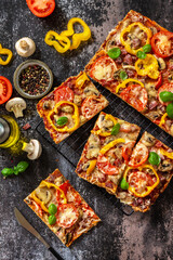 Homemade baking Detroit-Style pizza. Large rectangular Pepperoni pizza with mushrooms, salami and...
