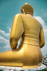 Giant golden buddha statue of Dhammakaya Thep Mongkol Buddha in construction site located at Wat...