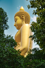 Giant golden buddha statue of Dhammakaya Thep Mongkol Buddha in construction site located at Wat...