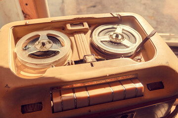 Old vintage player of reels. The antique Reel-to-Reel. Tape Recorder with spools. Bobbin tape recorder