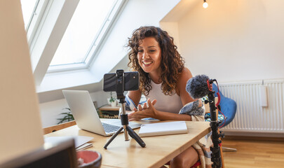 Young woman vlogger recording video for her video  channel.