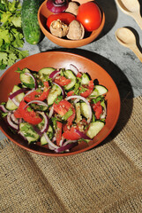  Fresh salad with tomatoes and cucumbers.
