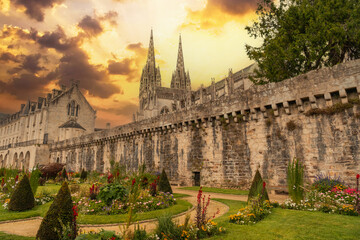 Sunset on the walls of the medieval town of Quimper and the cathedral of Saint Corentin, department...