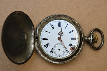 Broken antique pocket watch.