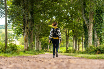 Obraz premium A young mother with her baby in the Broceliande forest, a French mystical forest located in the Ille et Vilaine department, Brittany, near Rennes. France