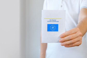 Unrecognized Vaccinated Man Showing Real Paper EU Digital COVID Certificate. Coronavirus Vaccination Advertisement Campaign. Vaccine Done