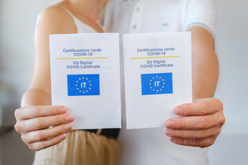 Unrecognized Vaccinated Family Showing Real Paper Italian EU Digital COVID Certificate. Coronavirus Vaccination Advertisement Campaign. Vaccine Done