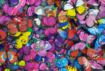Many colorful artificial butterflies in closeup